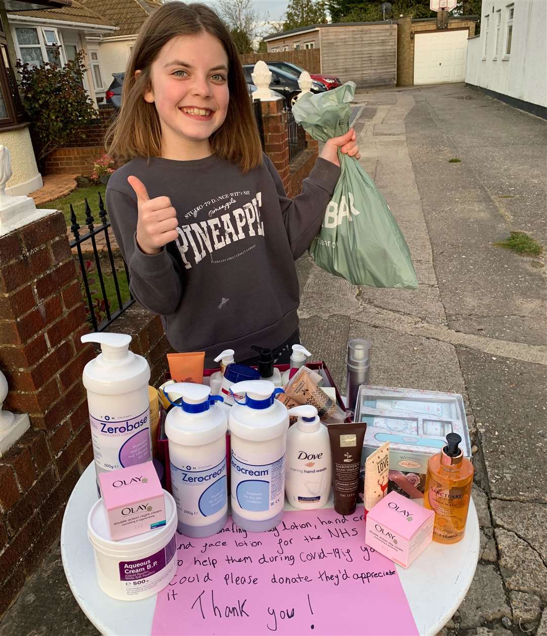 Anya Dixon, outside her house in Joydens Wood, collecting hand and face cream for NHS staff at Darent Valley Hospital