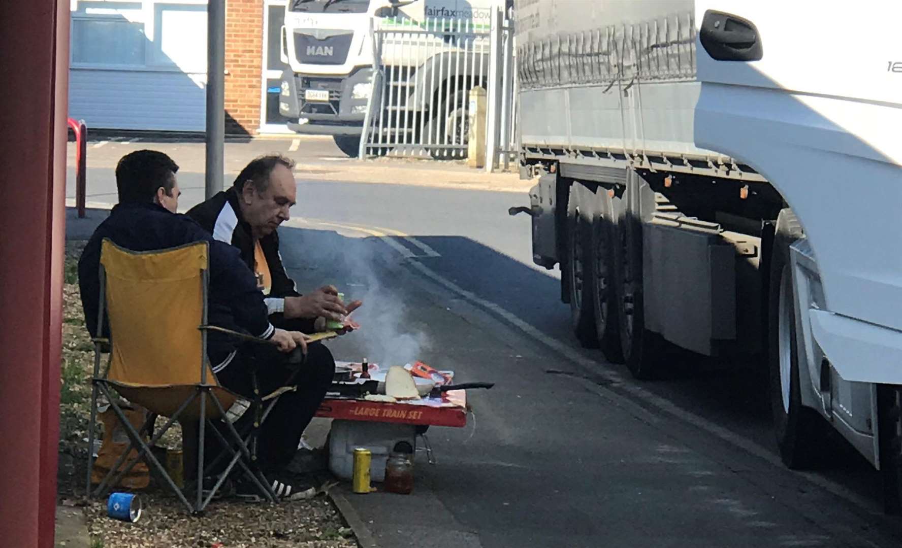 Drivers setting up a barbecue after pitching up is not an uncommon sight