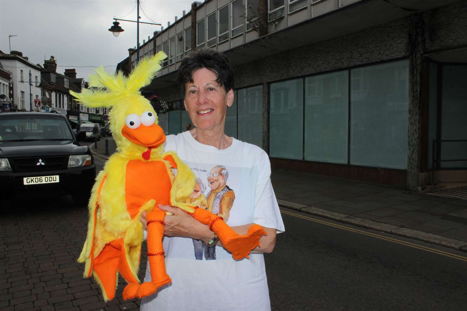 Eggwina Cluckbucket from Number 3 Tin Cottage gets taken for a walk in Sheerness High Street by author Meryl Ledbrooke