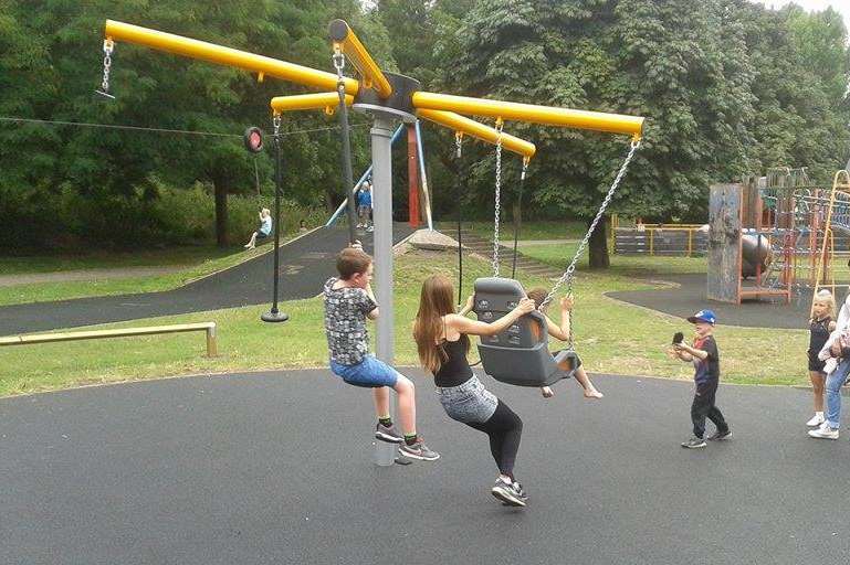Vicky helping children at the swings in Central Park