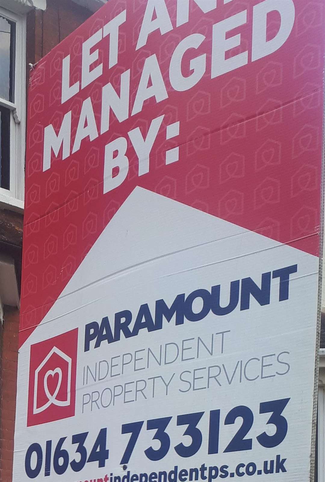 The Paramount sign outside the property