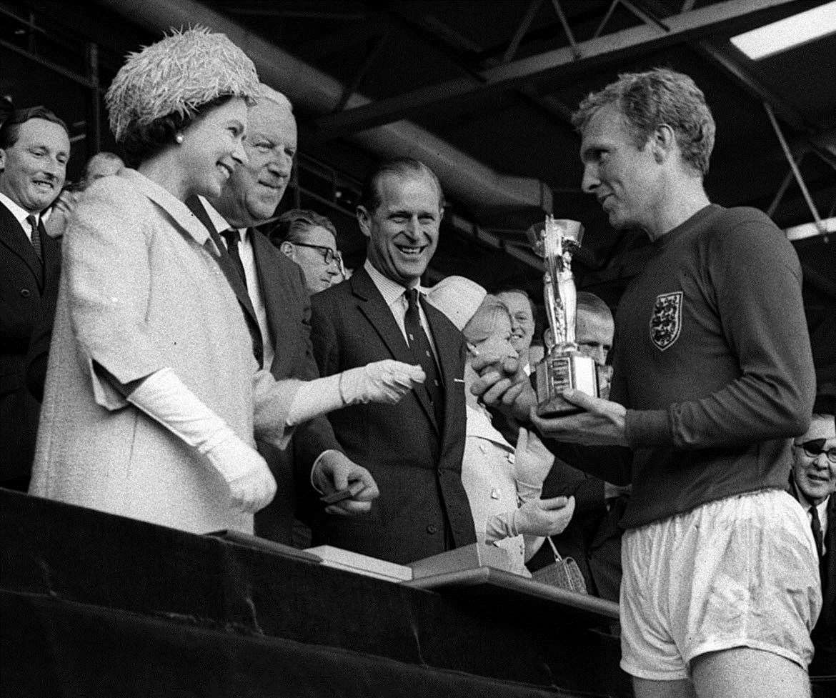Bobby Moore collects the prized Jules Rimet trophy from the Queen in 1966 at Wembley. Picture: PA