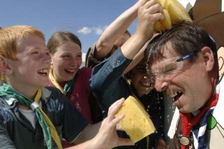 Scout master John Roberts gets a soaking from some of his 1st Aylesford Scouts. Picture John Wardley