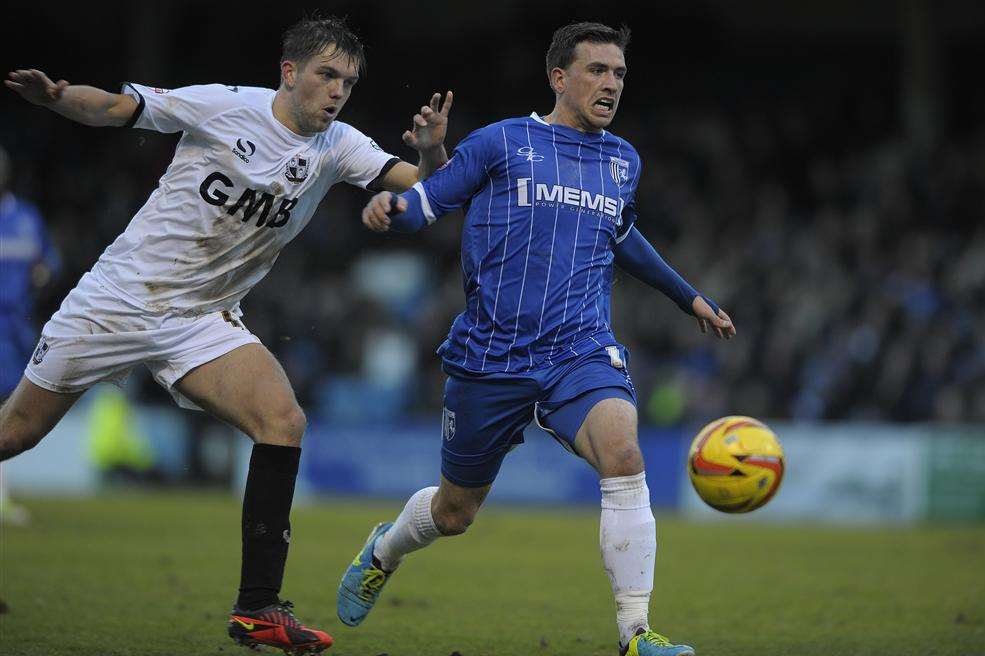 Cody McDonald takes on the Port Vale defence