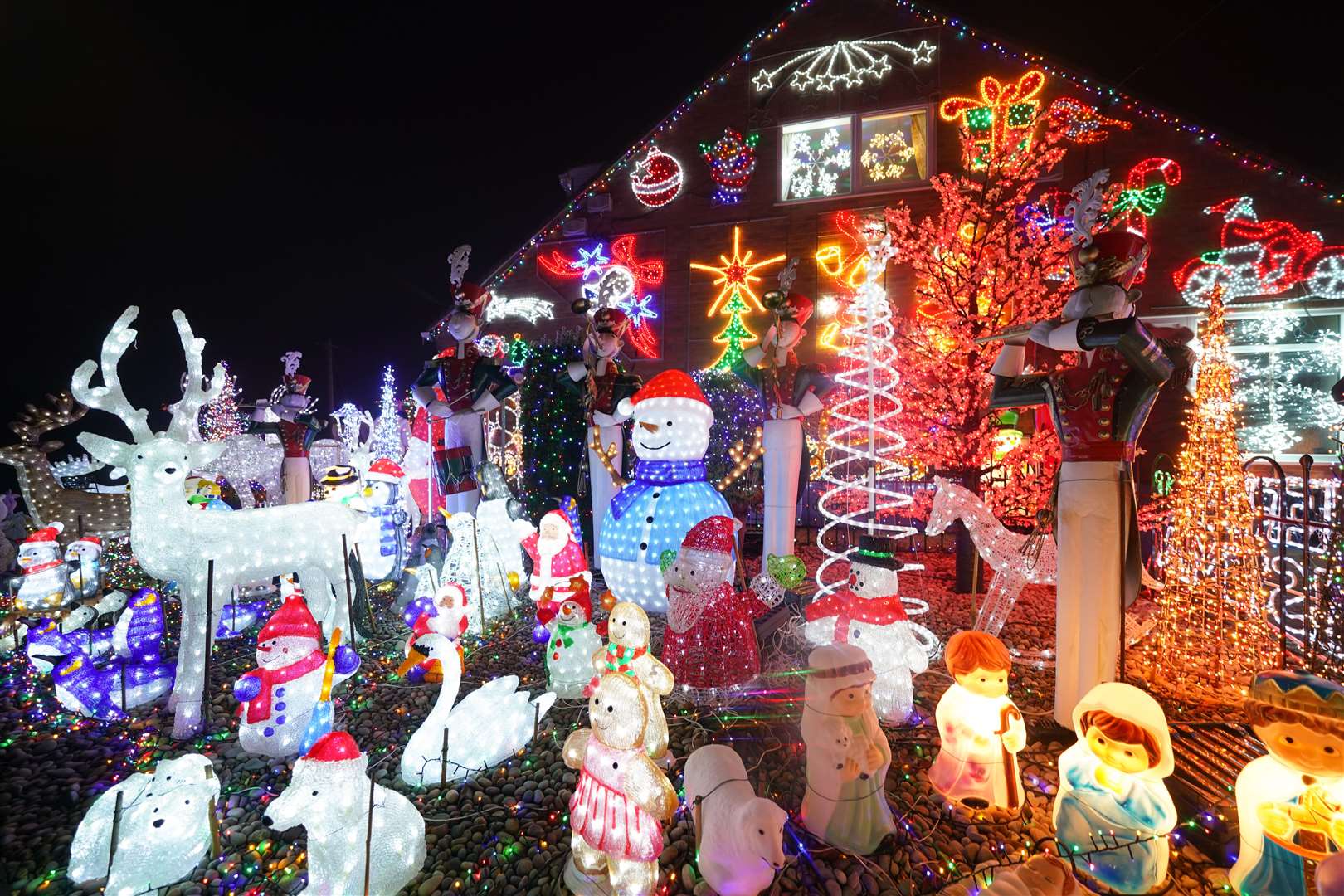 Helen and John Attlesey in Soham, Cambridgeshire, decorate their house every year to raise money for charity. The money raised is donated to East Anglia Children’s Hospices, Great Ormond Street Hospital Children’s Charity and Dreamflight, who helped their grandson Jacob recover from a serious form of epilepsy (Joe Giddens/PA)