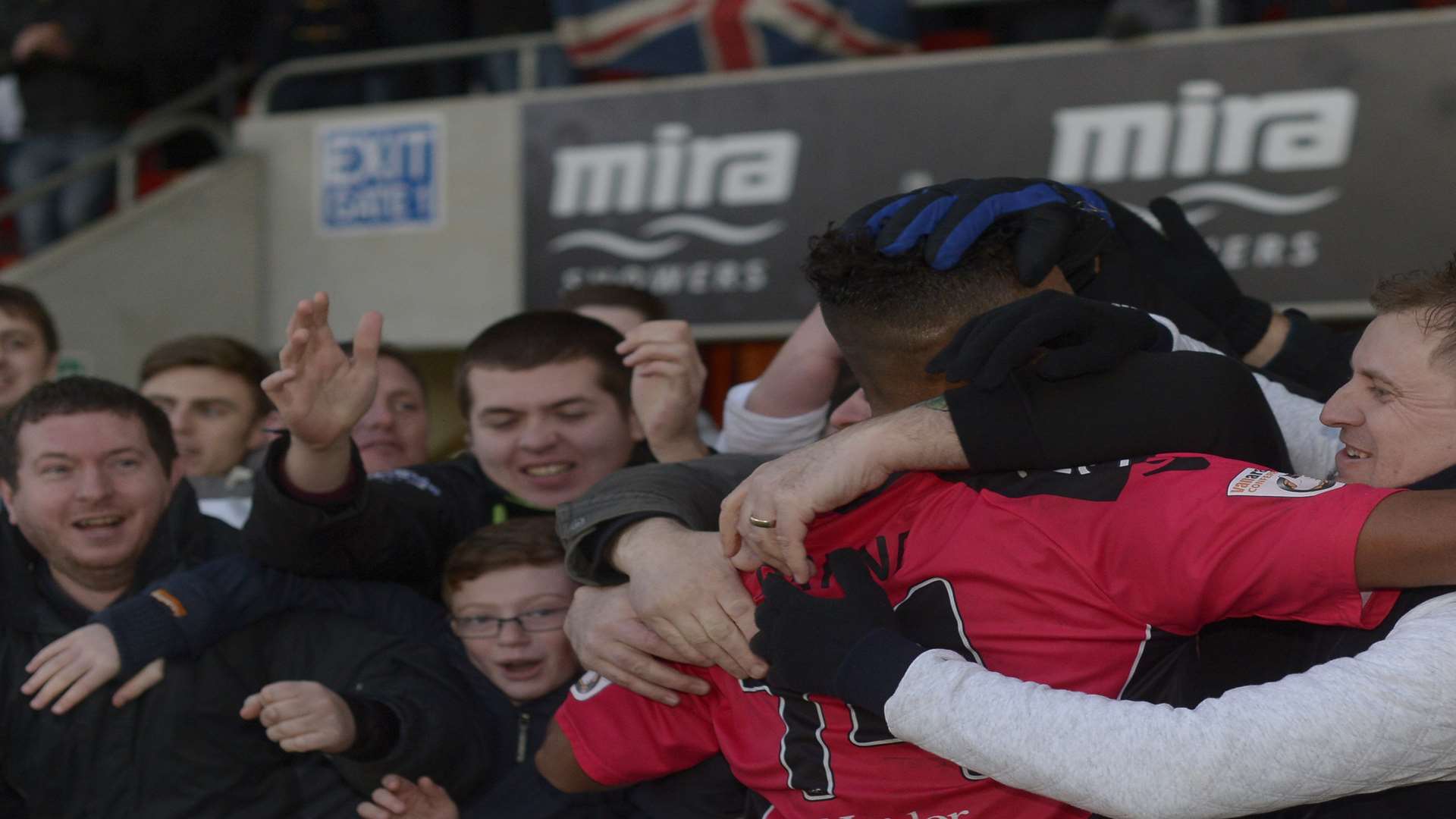 Stefan Payne is mobbed by the Dover fans after the 1-0 win in FA Cup second round clash at Cheltenham Town. Picture: Ady Kerry