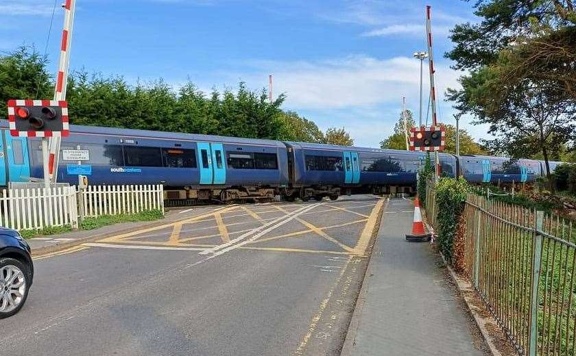The moment the train went past the opened barrier at Sandwich. Picture: Colin Buckle