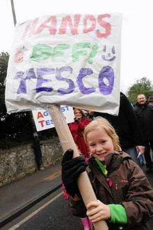 A little girl joins the anti-Tesco march in Herne