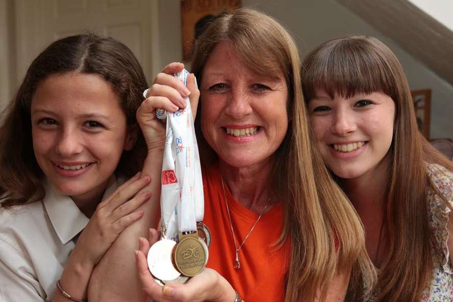 Ella Clifford, left, with mum Nicky Clifford and sister Megan