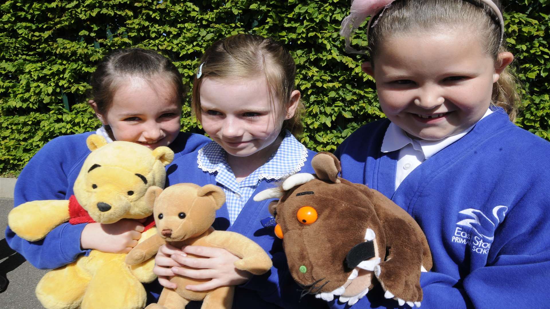 Ellie Shaw, Abbie Empett and Chelsea Prior from East Stour School have their cuddly toys at the ready for Ted's Big Day Out.