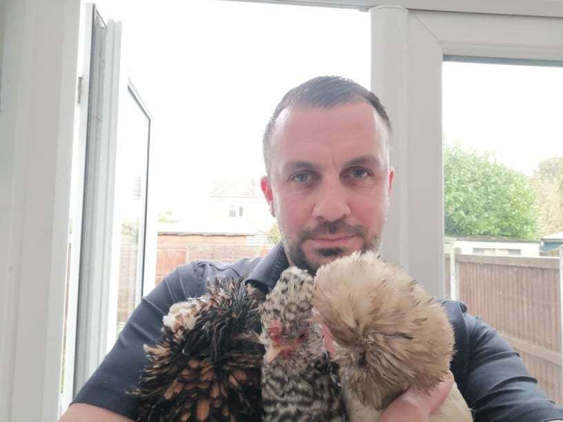 Andrew Eve with his pet chickens