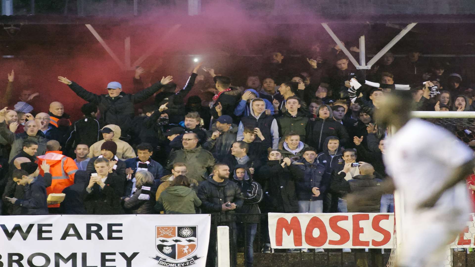 Bromley fans celebrate by letting off a flare Picture: Andy Payton