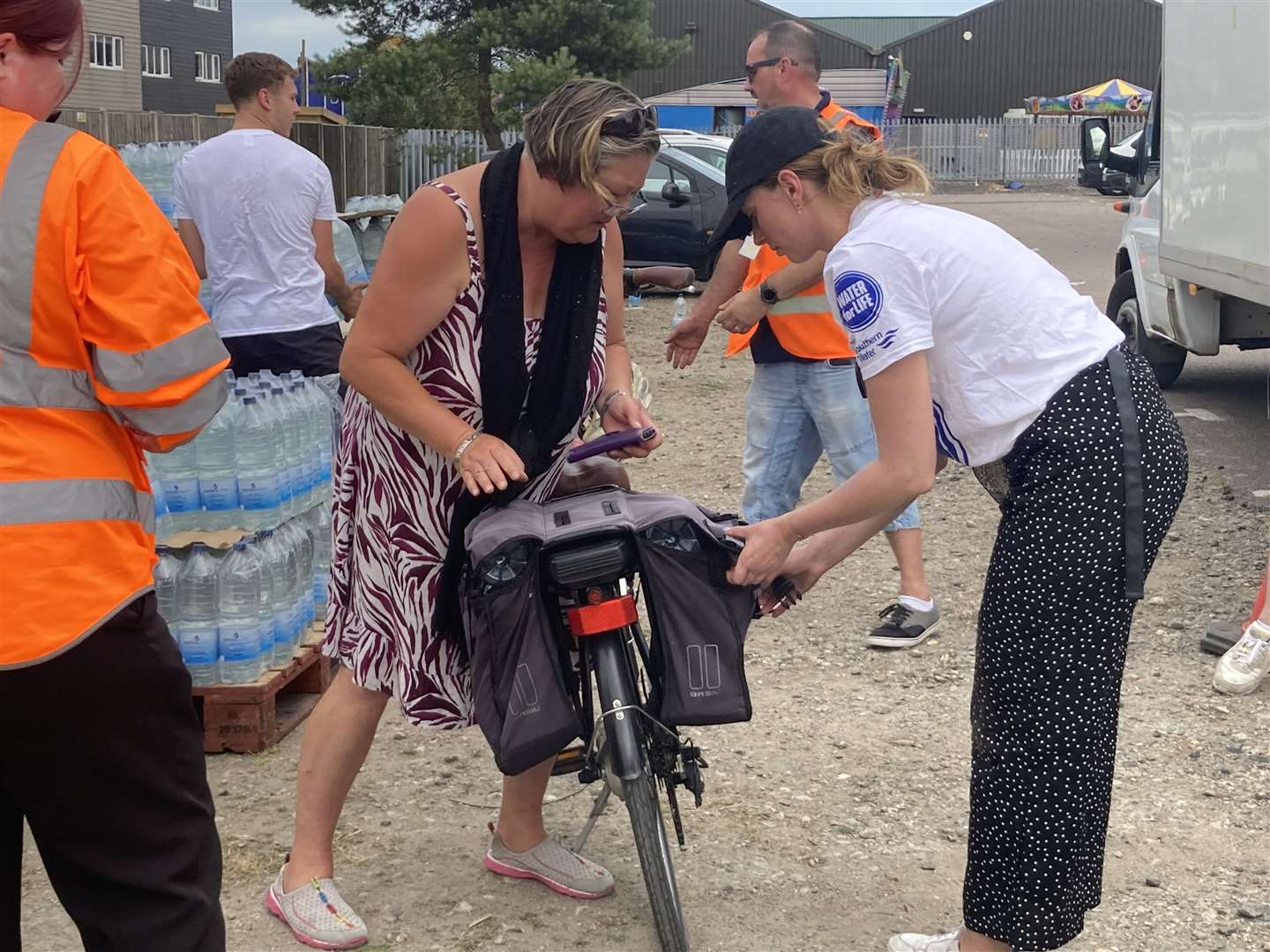 Handing out bottles of water at Leysdown on the Isle of Sheppey in July