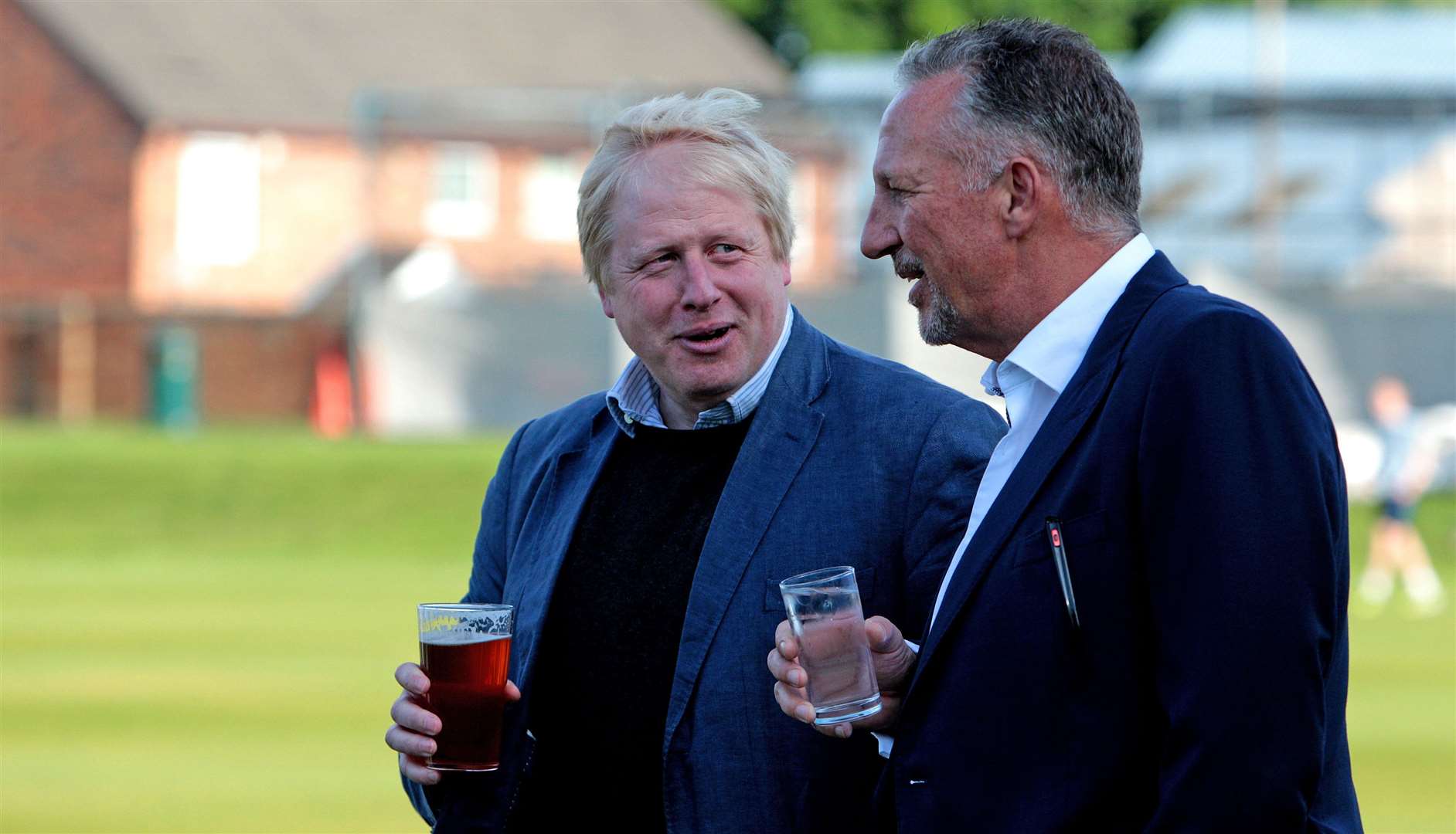 Boris Johnson talking to former England cricketer Sir Ian Botham who has been nominated for a peerage (Peter Byrne/PA)