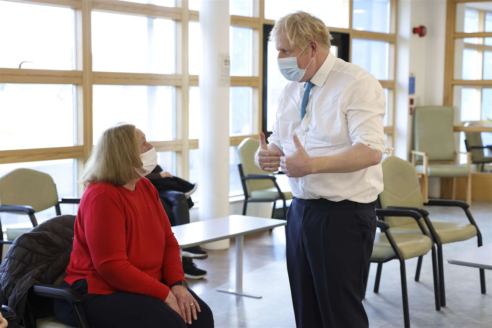 Boris Johnson talks to a woman in the waiting area of the Kent Oncology Centre, Maidstone. Picture: Andrew Parsons / No 10 Downing Street