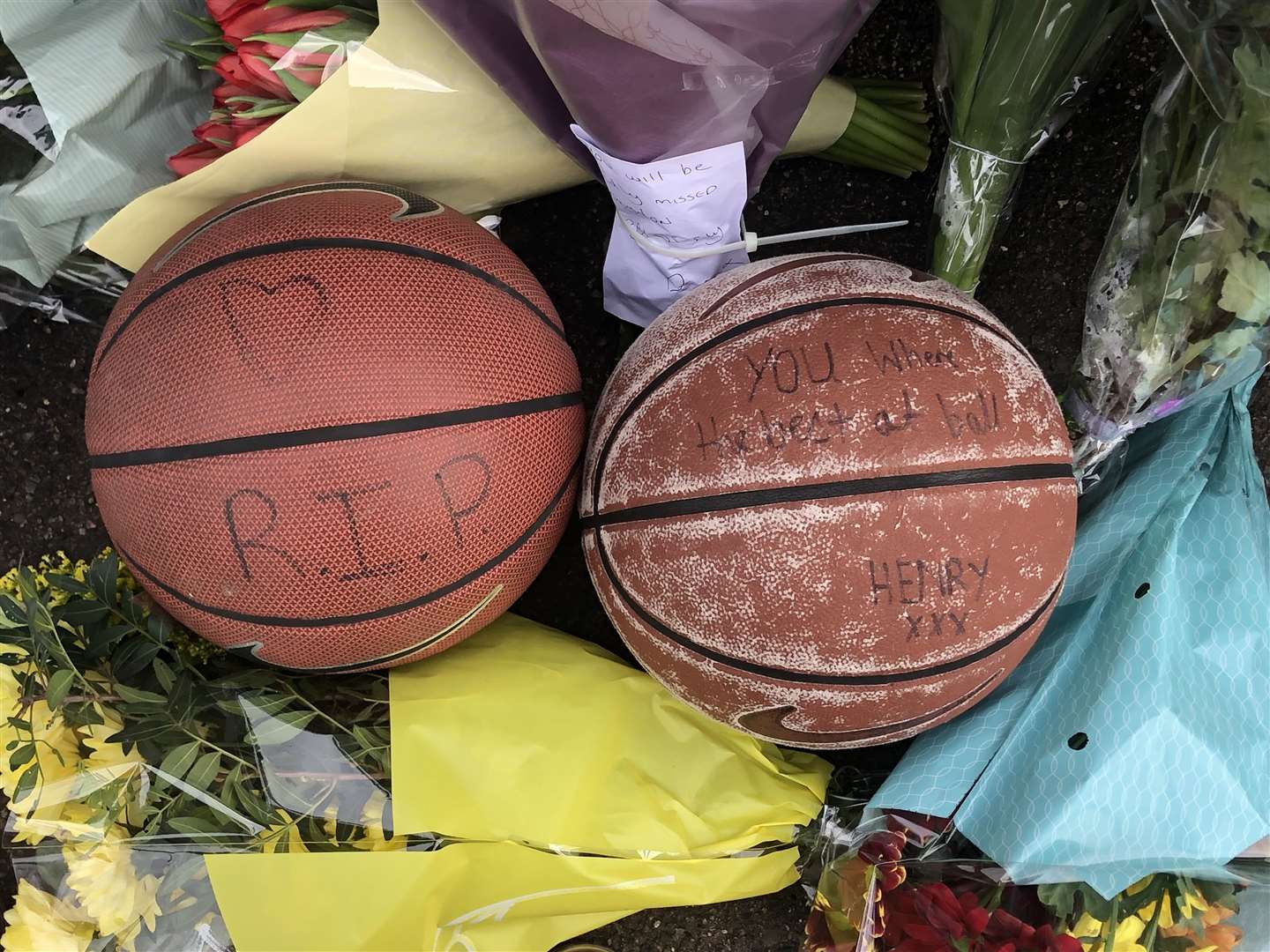 Floral, candle and basketball tributes have been laid in Vale Road