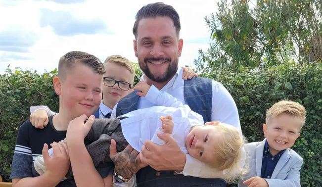Rick Smith with his three children and stepson. Picture: Katrina Binfield