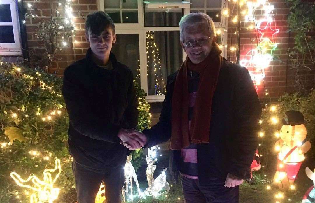 Callum Dunne with chairman Des Long, standing in front of his decorated home. Picture: Maidstone Homeless Care