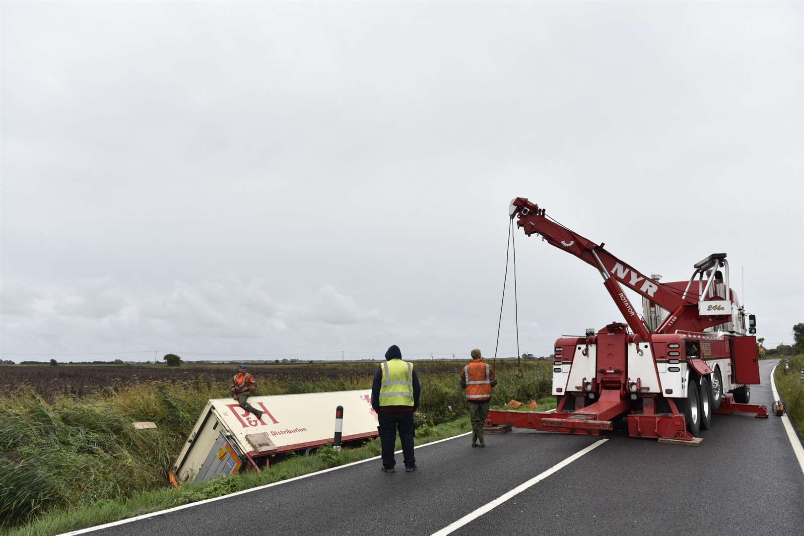 Recovery work is under way to bring the lorry out of the ditch. Picture: Alan Langley