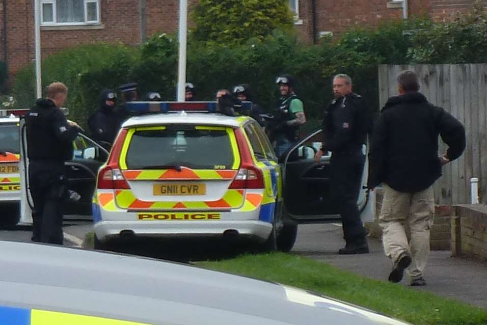 Armed officers flooded the residential street. Picture: Matt Leclere