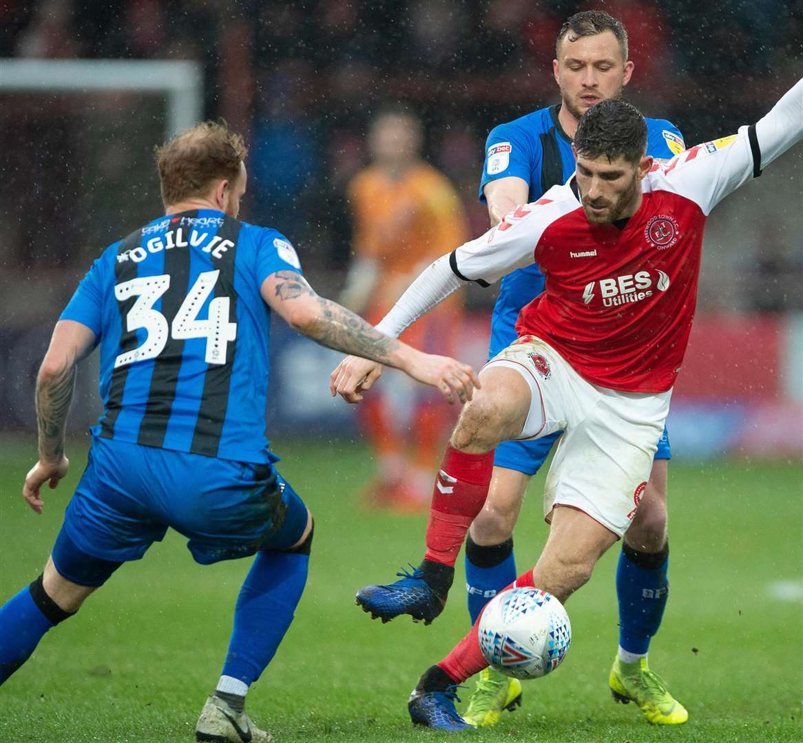 Ched Evans controls the ball in front of Dean Parrett and Connor Ogilvie Picture: Ady Kerry