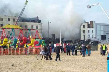 Fire tears through the Margate amusement arcade. An adjoining building, Mr G's, collapsed.