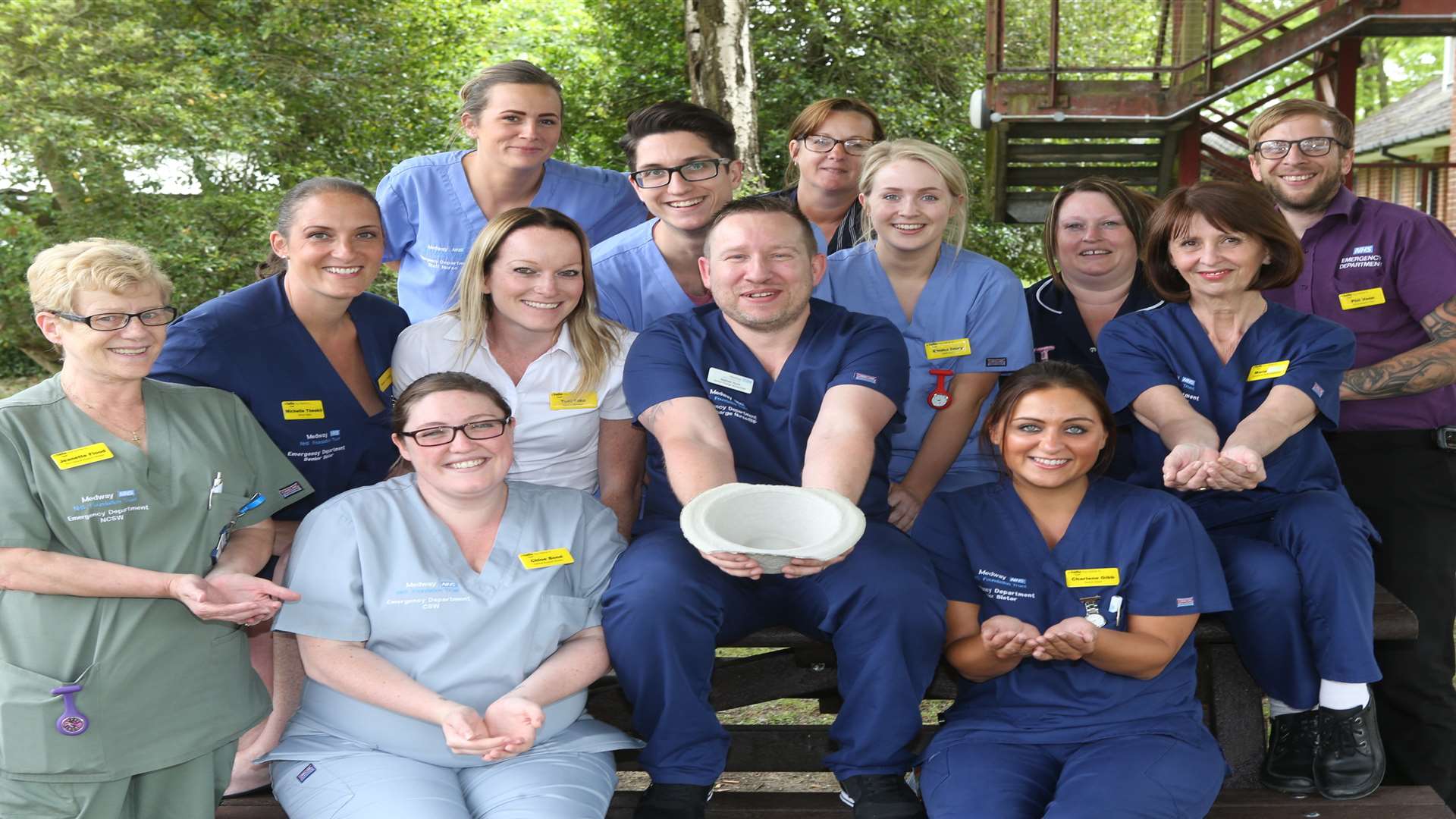 Nathan Hunt, emergency nurse practitioner with colleagues who raised £115 for Mr Summers