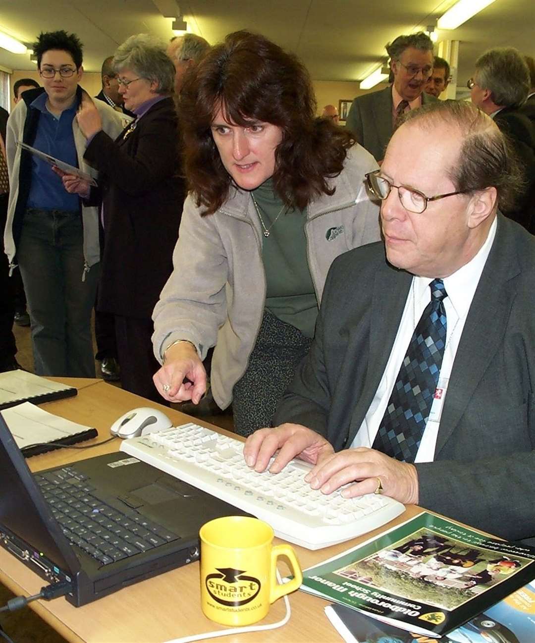 Cllr Daley getting to grips with new technology with guidance from Linda Williams at the opening of the Cyber Cafe at Oldborough Manor Community School in 2002