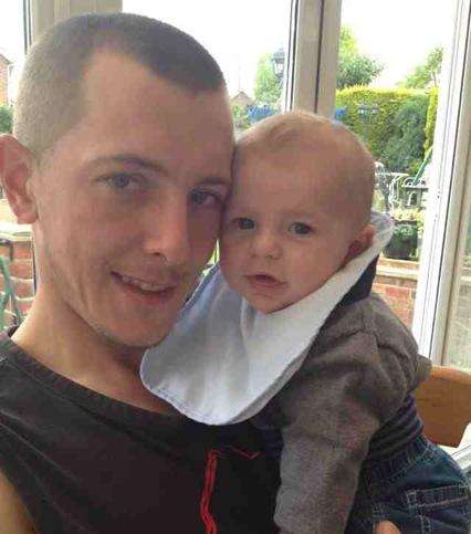 The man Mr Nicholls saved - Wesley Barnes, 25, pictured here with his son Frankie.