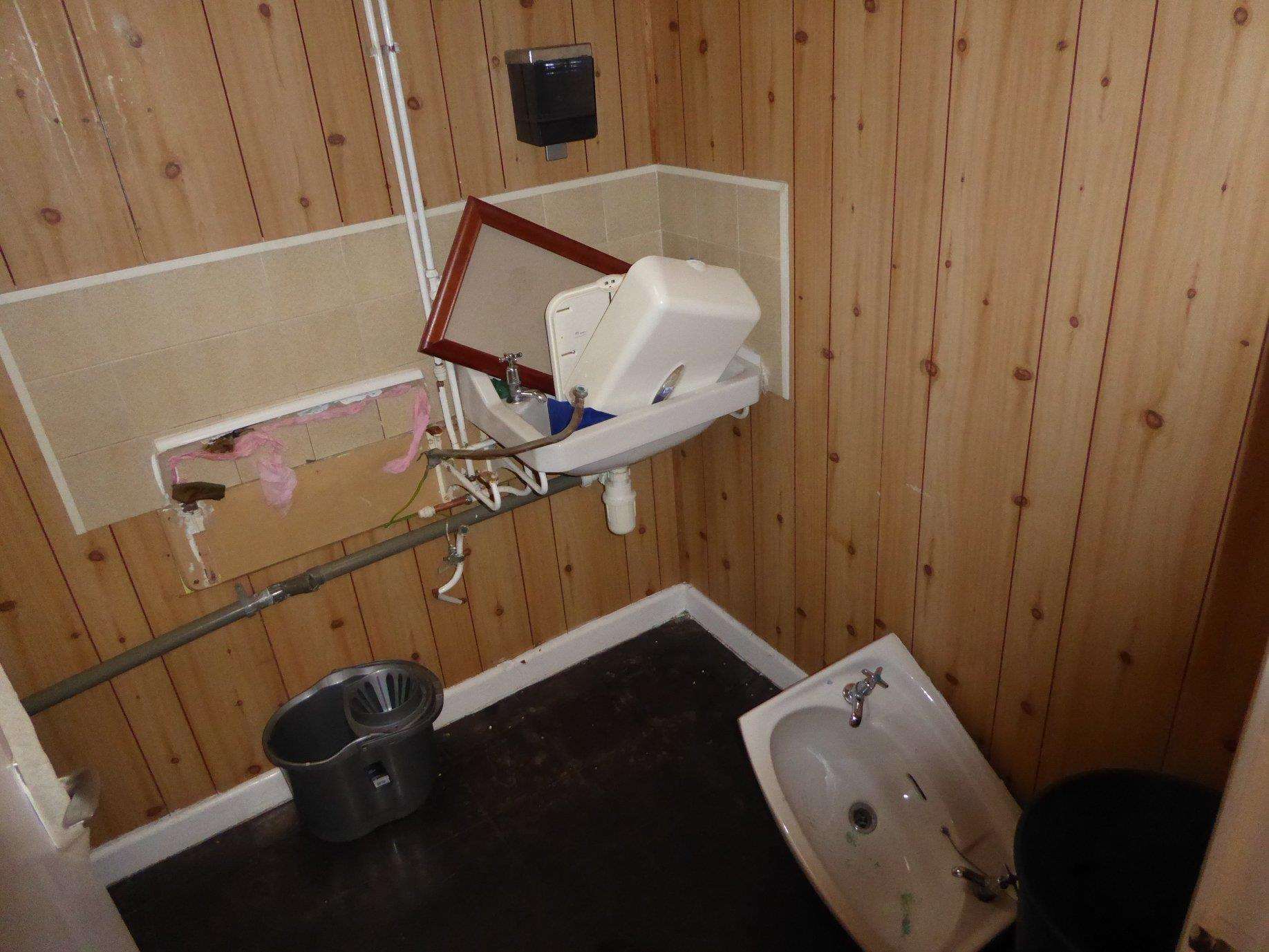 The gents' toilet was flooded following the "mindless vandalism"
