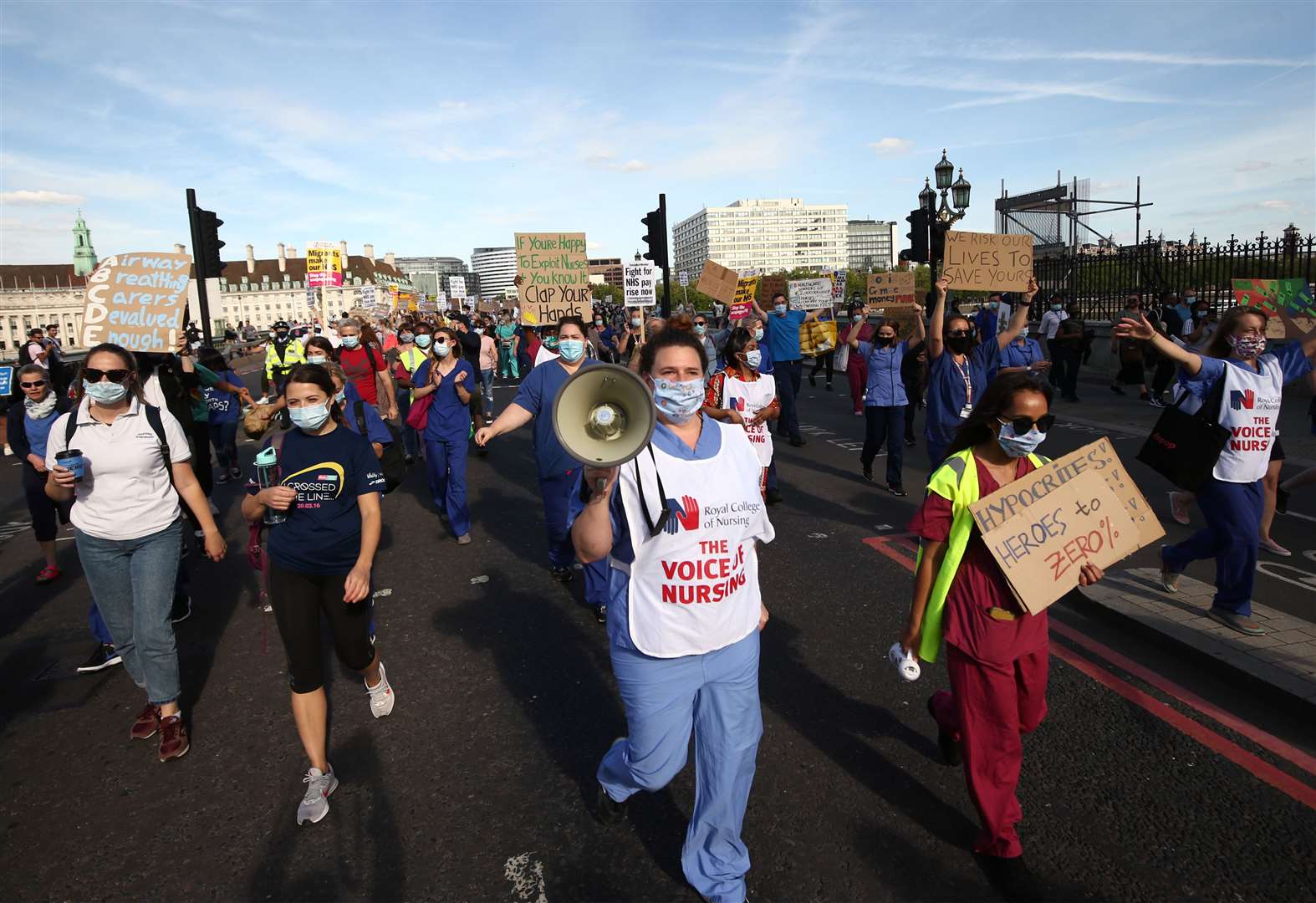 NHS workers march from St Thomas’ Hospital to Downing Street (Yui Mok/PA)