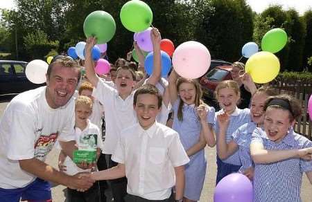Phil Tufnell meets pupils at Fordcombe primary school during his walk in aid of Macmillan Cancer Relief. Picture: JOHN WARDLEY