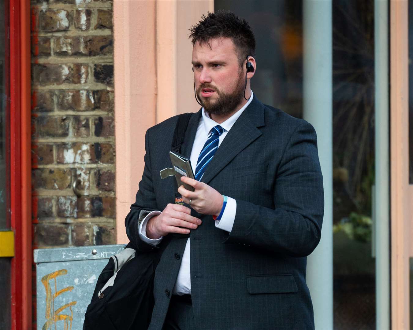 PC Andrew Brooks arrives at a disciplinary hearing at the Met Police headquarters in London. Picture: SWNS