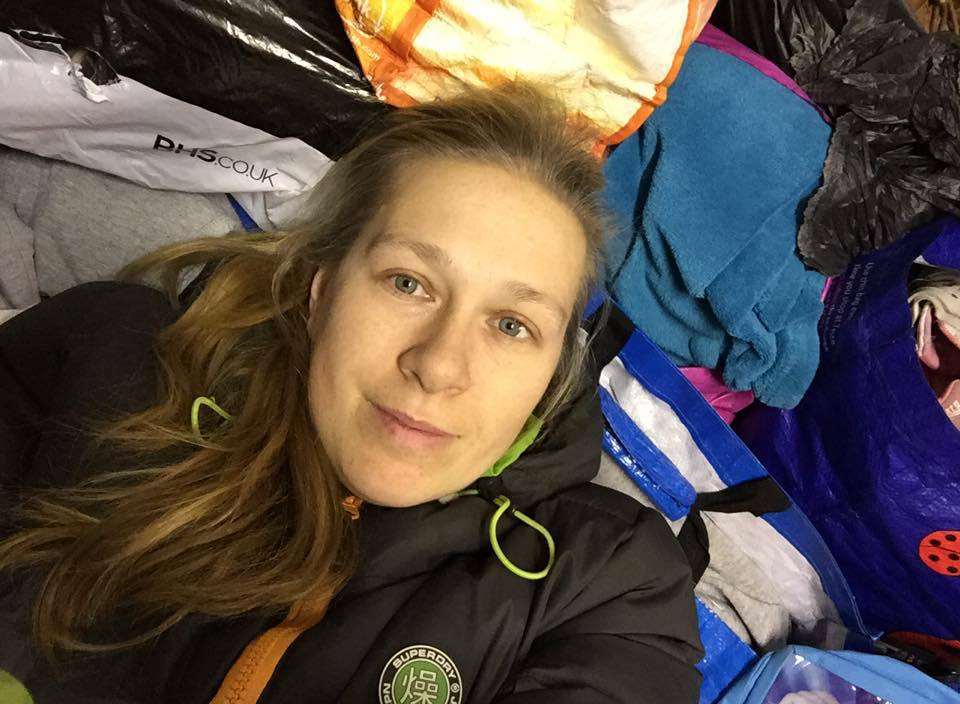 Laura Teisler-Goldsmith sorting through clothing for Leros