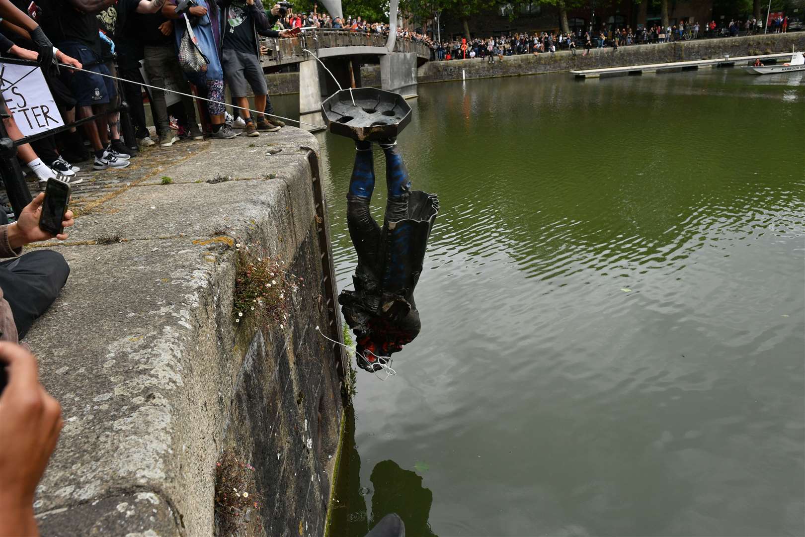 Protesters throw the statue of Edward Colston into Bristol harbour (Ben Birchall/PA)