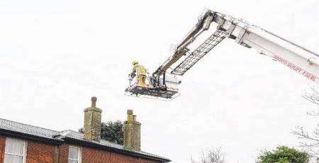 A firefighter trains in tackling a chimney fire