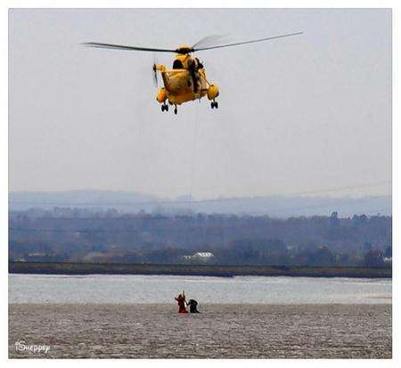 The dramatic moment two people had to be rescued from the mud after getting stuck at Shellness Point