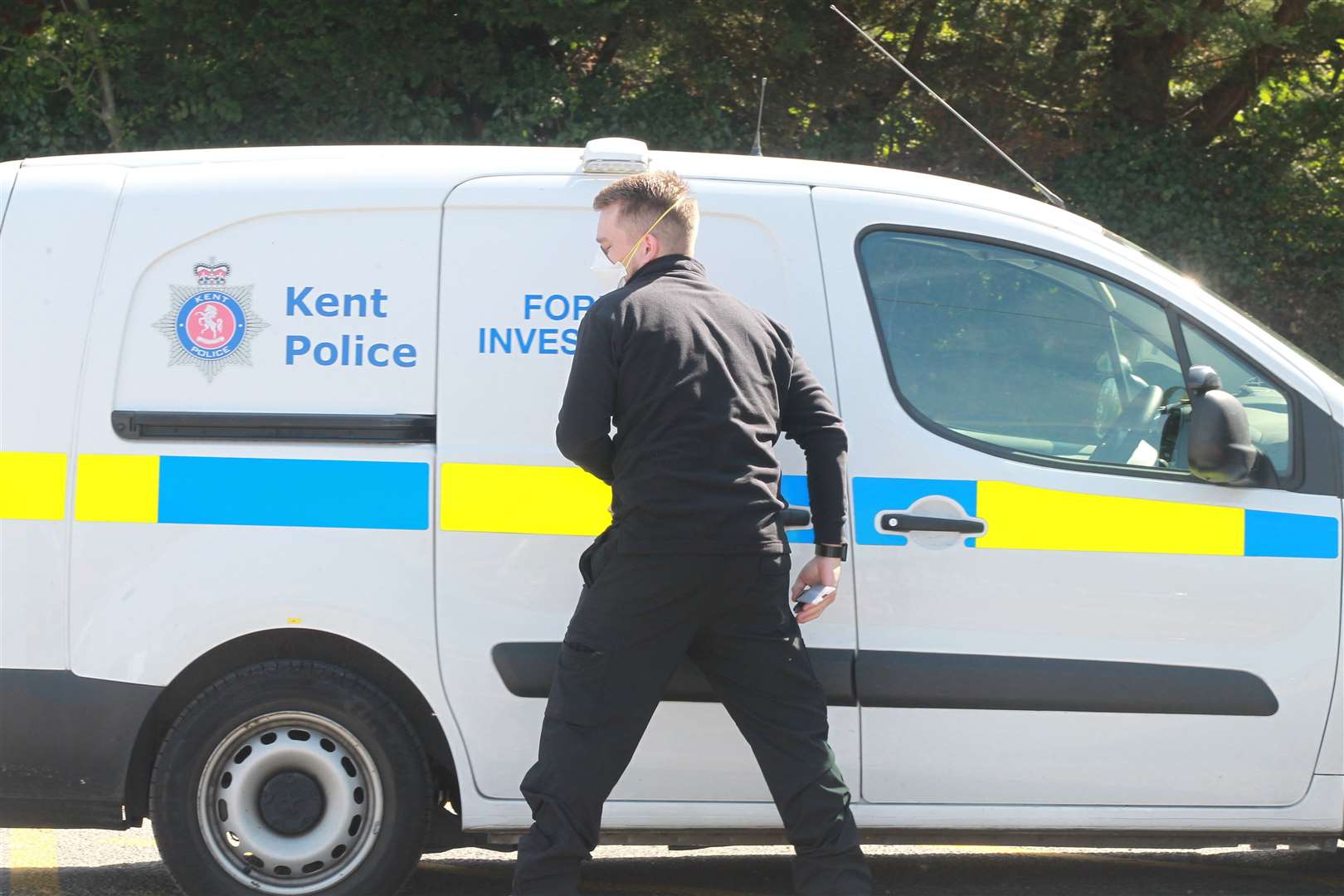 A forensic officer outside Headcorn Station yesterday