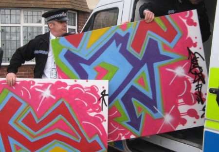 Police investigating hundreds of graffiti offences recover evidence from a Margate address. Pictures: KIM SANDERS