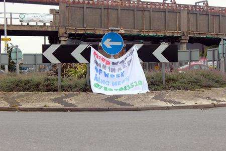 Kevin Crane put a banner on the roundabout telling prospective employers he is a hard-working man looking for employment