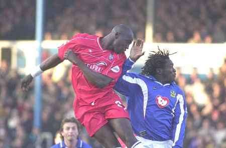NEAR MISS: Gillingham front man Sidibe, left, goes close with a header against Pompey. Picture: GRANT FALVEY
