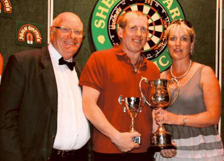 Sheppey Darts Classic singles winner Andy Belton with organiser Tony Cox and Lee Dunn, owner of Merlins