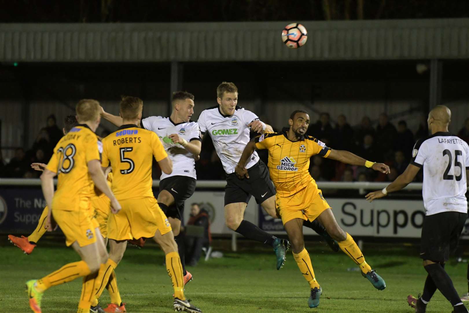 Jamie Grimes (centre) gets up for a header during his time at Dover Picture: Barry Goodwin