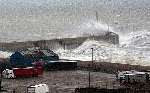 Huge waves dwarf lorries as storms lash the seafront at Folkestone. Picture: CHRIS DENHAM