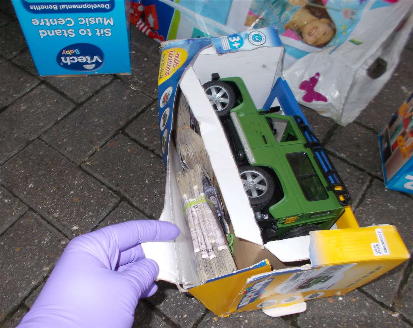 Cash hidden within the toy packaged found in the boot of the car. Picture: Border Force