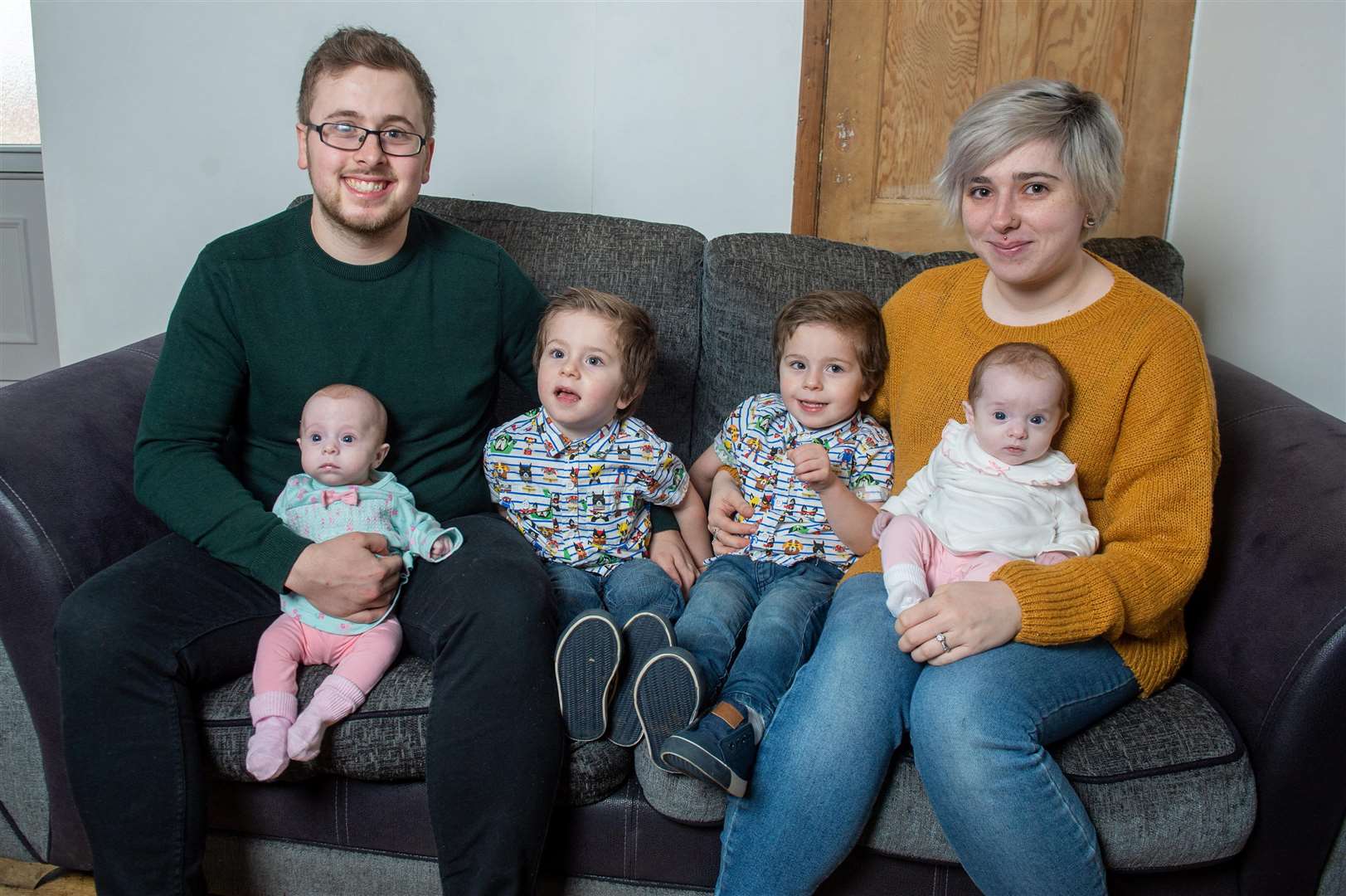 Parents Jessica Phoenix and Liam McMahon with their two-year-old twins Harry and Elijah and their younger twin siblings Phoebe and Aria. Picture: SWNS