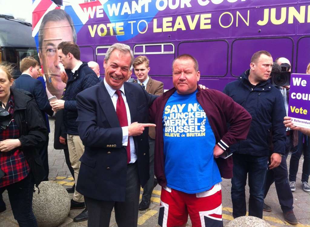 Nigel Farage on the campaign trail with a voter