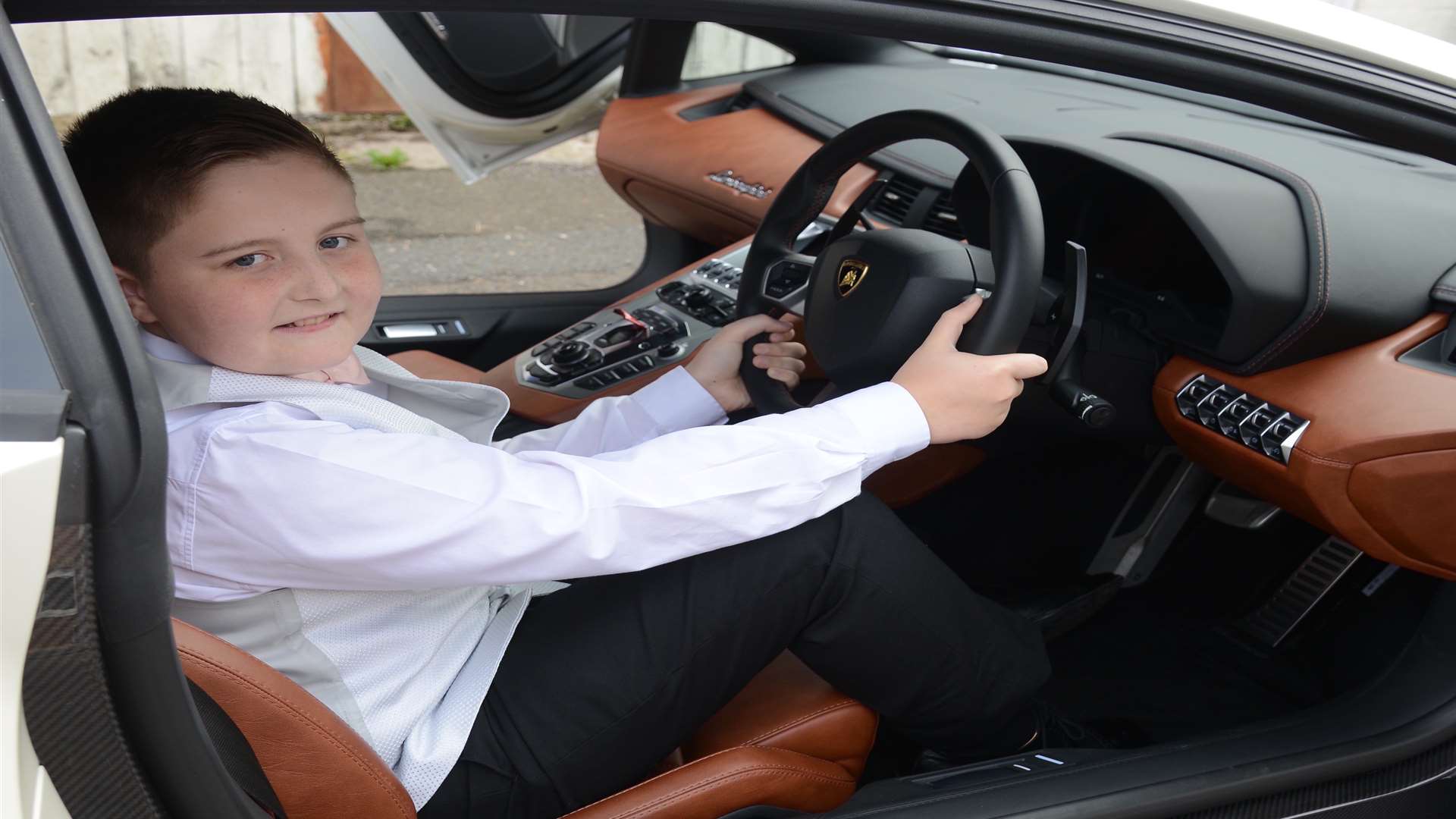 The youngster samples life in the driving seat