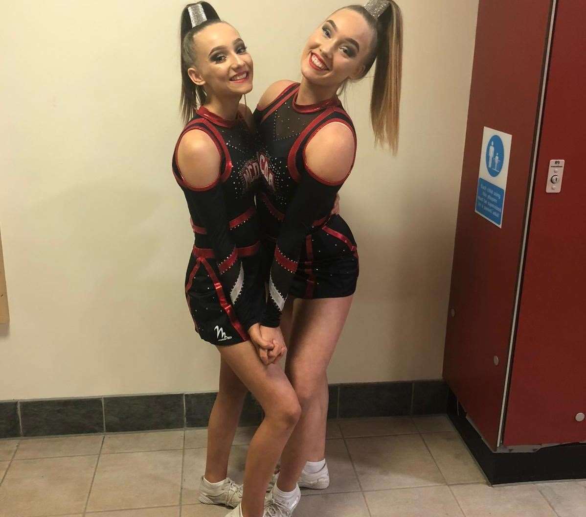 Taylor and Madison Joslin-Wood posing in their cheerleading uniforms. Picture: Jennifer Joslin-Wood