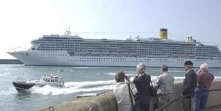 The Costa Mediterranea draws spectators to the end of the Prince of Wales Pier. Picture: CHRIS DAVEY